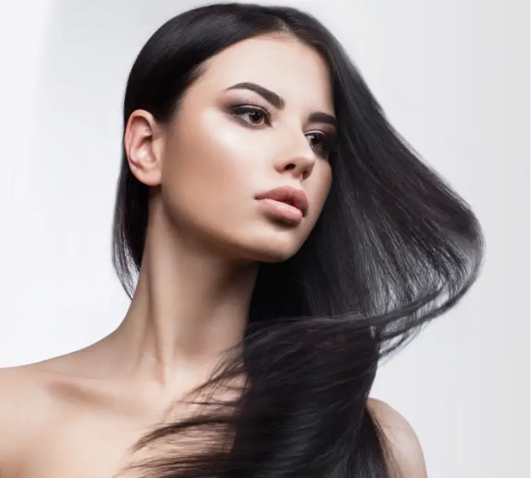 Woman with long black hair after facial fillers and injectables in Newport Beach.